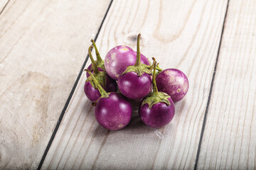 Raw small purple asian baby eggplant