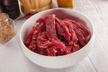 Raw beef meat - sliced strips