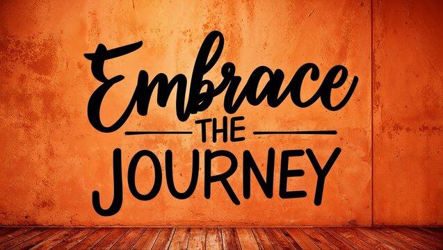 embrace the journey inspirational quote painted on a rustic orange wall background