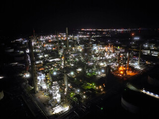 Oil refinery aerial view, shot from a drone. Production of oil and chemicals. Night shooting.