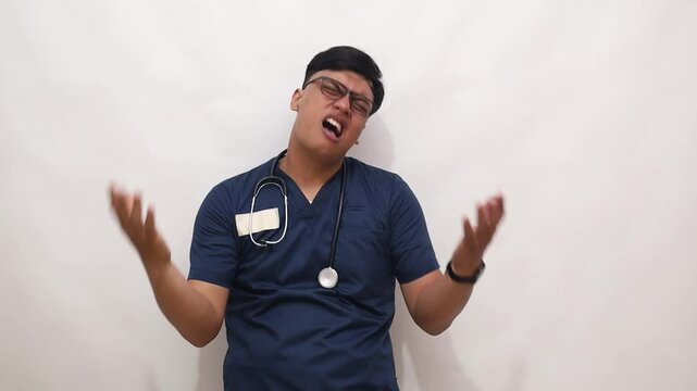 Confused Asian doctor man feeling embarrassed about ambiguous question, having doubts, no answer, clueless. Isolated on white background