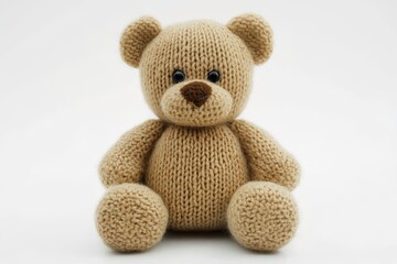 Obraz premium A knitted teddy bear on a white background.