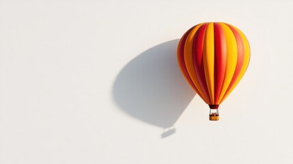 Obraz premium Red and yellow hot air balloon, floating majestically in a white space, with shadow detail.