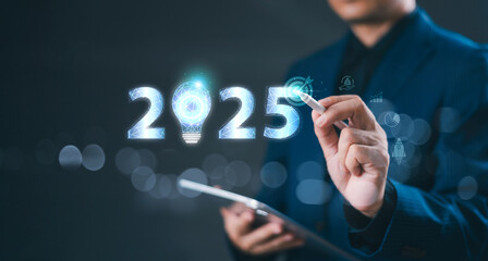 2025 new year forecast strategy. Startup business 2025 positive indicators concept. Businessman use tablet write 2025 target goals icon, virtual screen technology.  Merry Christmas idea inspirations