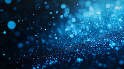 Fototapeta premium Abstract bokeh of blue gold glow particles on a dark background with copy space, creating a mesmerizing and dreamy visual effect
