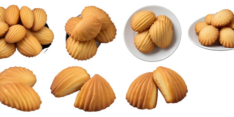 Fototapeta premium Assorted madeleines on a plate and in a stack, showing their distinctive shell-like shape and golden-brown color with a Transparent Background