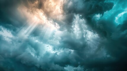 Obraz premium Amazing sky with a mix of dark storm clouds and rays of sunlight breaking through