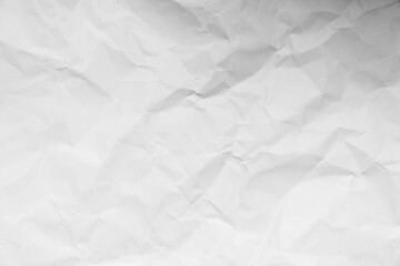 Grunge wrinkled white color paper textured background with copy space. Use for decoration or layer