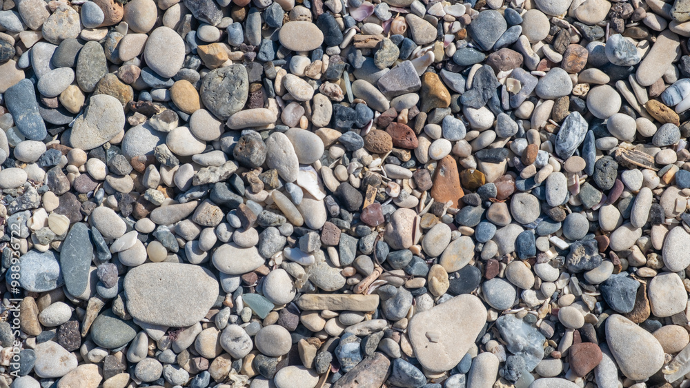 Poster the beach showcases a diverse collection of smooth and colorful pebbles scattered along the shore, r
