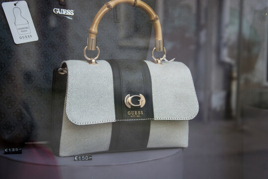 Mulhouse - France - 19 September 2024 - Closeup of white leather handbag with famous pattern by Gucci in a luxury fashion store showroom