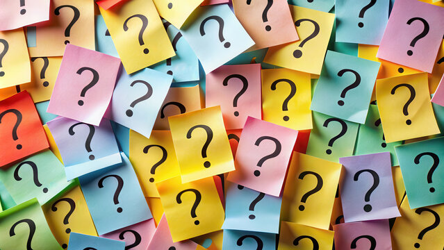 Collection of memo notes with question marks, representing seeki