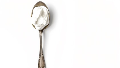 Spoon of whipped cream isolated on white background