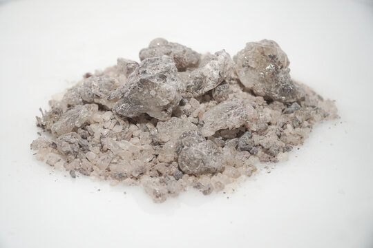 Aromatic heap of Damar Mata Kucing (Shorea Javanica) resin gum copal grade, also known as Dammar gum, isolated on a clean white background.