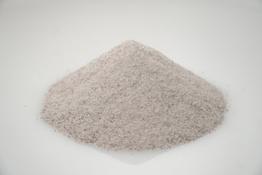 Aromatic heap of Damar Mata Kucing (Shorea Javanica) resin gum fine dust, also known as Dammar gum, isolated on a clean white background.