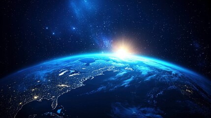 Fototapeta premium The breathtaking blue hues of a sunrise casting light on the planet below, viewed from the expanse of space.