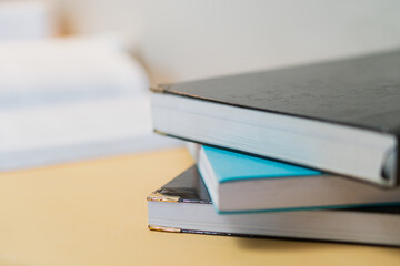 Stack of Books on a Wooden Desk for Study