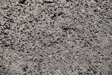 A high-resolution image showcasing the texture of rough concrete, ideal for backgrounds or design elements.