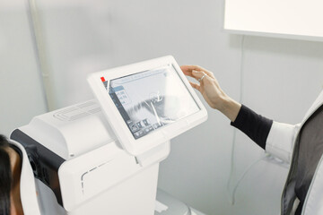 Optometrist checking sight of a patient on special equipment