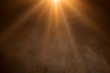 orange spotlight on stage or gods rays isolated on black background