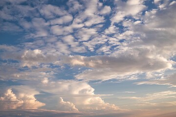 Obraz premium A vast expanse of the sky, dominated by a mesmerizing display of clouds