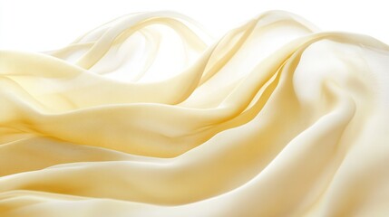 Obraz premium Soft yellow chiffon fabric billowing gently, creating delicate ripples, isolated on white.