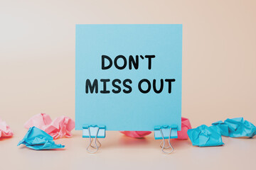 "Don't Miss Out" Written on a Sticky Note. Ideal for Marketing Promotions, Sales Campaigns, and Urgency Messaging. Blue Note on a Neutral Background