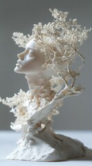 White porcelain sculpture of a woman with intricate branches growing from her head.