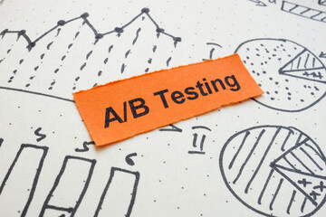 Drawn graphs with the words A B testing. Marketing experimentation concept.