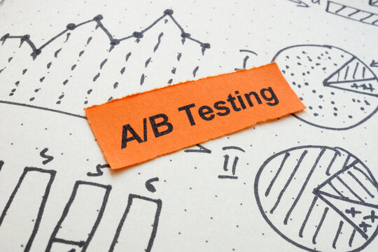 Drawn graphs with the words A B testing. Marketing experimentation concept.