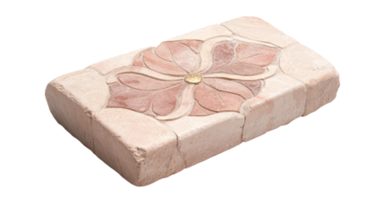 A brick with a flower design on it