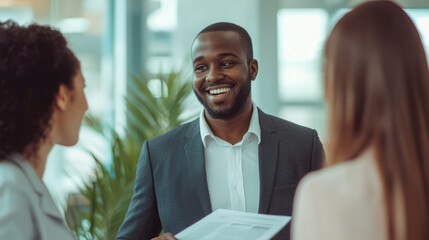 A corporate compliance officer reviewing ethical guidelines with a team in a bright office