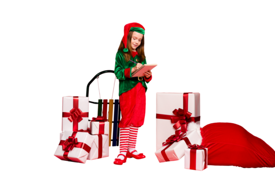 Full length body size view of nice attractive calm peaceful focused small little pre-teen elf writing winter holly jolly fairy tradition idea wish list isolated over bright vivid shine red background