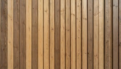 Fototapeta premium Wall made of wooden panels. Vertical wooden slats for facade cladding. Timber stripes made of beige pine. A modern plank surface for interior and exterior design