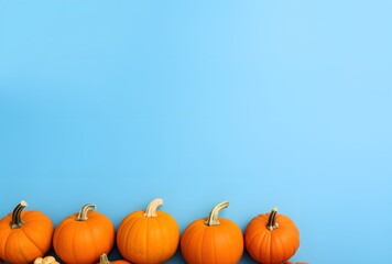 Autumn Pumpkins on Blue Background Flat Lay