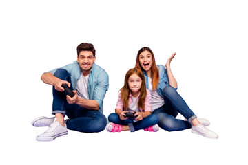 Photo of three family members sitting floor trying hard to win team game wear casual clothes isolated purple background © deagreez