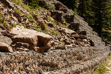 The terracing of the rocky mountainside along Old Fall River Road, to protect slides, within Rocky Mountain National Park, Colorado.