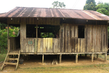 Old wooden house. Indigenous hut in the Amazon, Colombia. This rustic structure represents the harmony between  communities and nature. Amazonian culture.