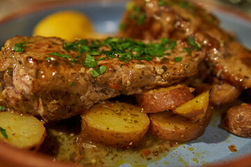 llama loin with potatoes, spicy sauce and green onions. Traditional Argentinian food in Jujuy, Argentina