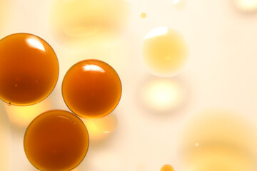 Close-up of oil droplets floating on water.