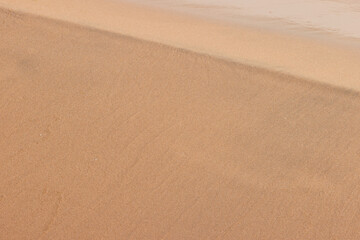 The sandy beach interface to Lake Michigan at Harrington Beach State Park, Belgium, Wisconsin, slightly reconfigured with each casual wave