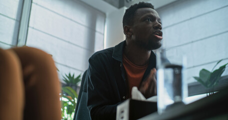 Aggressive African American man loses self control, starts quarrel and yells during couples...