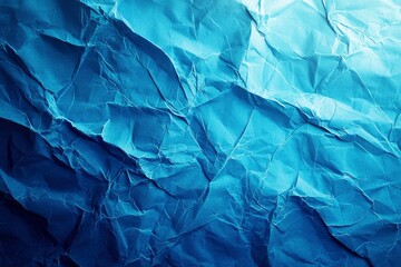 Fototapeta premium Close-up of Crumpled Blue Paper with Light Reflection