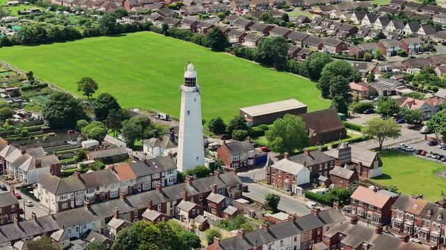 Withernsea is a seaside resort and civil parish in Holderness, East Riding of Yorkshire. Its white inland lighthouse, rising around 127 feet above Hull Road, now houses a museum 