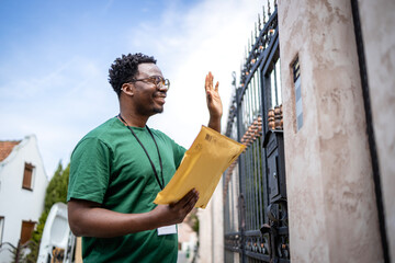 Shipment arrived. Postman waving to the recipient and delivering letters.