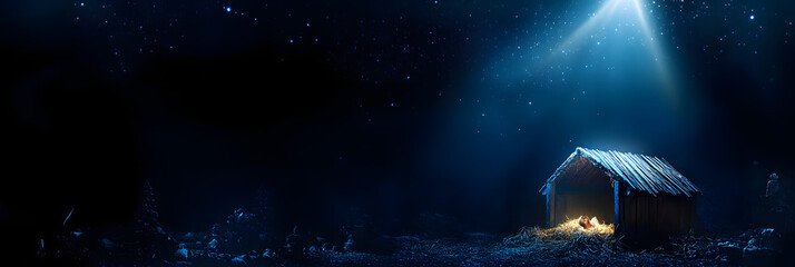Christian Christmas concept. Birth of Jesus Christ. Wooden manger in dark blue night. Banner, copy space. Nativity scene. Jesus is reason for season. Salvation, Messiah, Emmanuel, God with us, hope