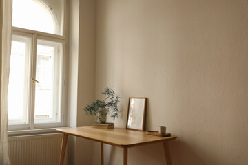 Christmas Scandinavian interior. Minimal winter artistic composition. Blank vertical wooden picture...