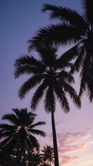 Naklejka premium Serene Tropical Sunset with Silhouetted Palm Trees Against a Stunning Purple and Pink Twilight Sky