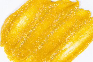 Smear of mustard sauce on white background isolate, creativity in cooking, macro texture © Zarina Lukash