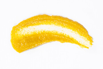 Smear of mustard sauce on white background isolate, creativity in cooking, macro texture