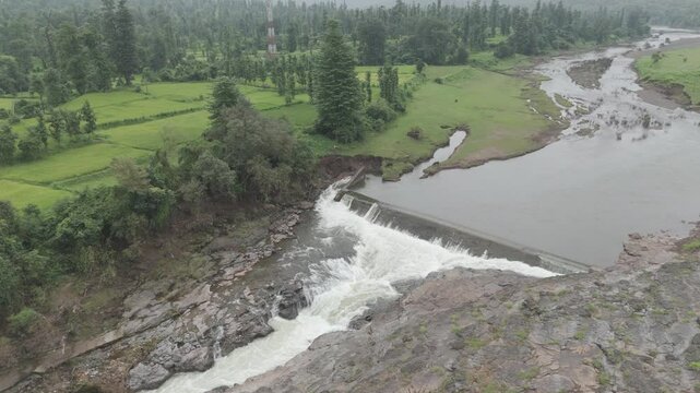 Raw footage Aerial view of river with Dam near agriculture field Located in Mayadevi Temple in Dang Gujarat.  